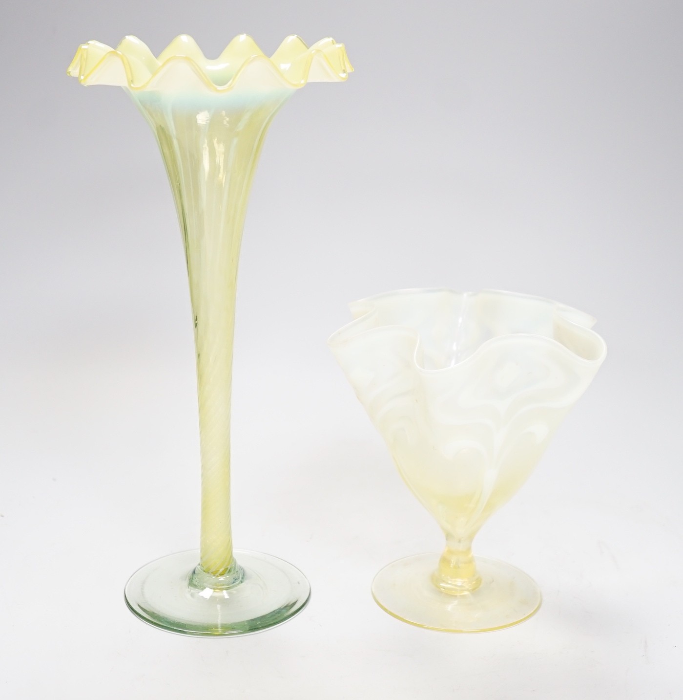 Two early 20th century vaseline glass vases, tallest 29cm